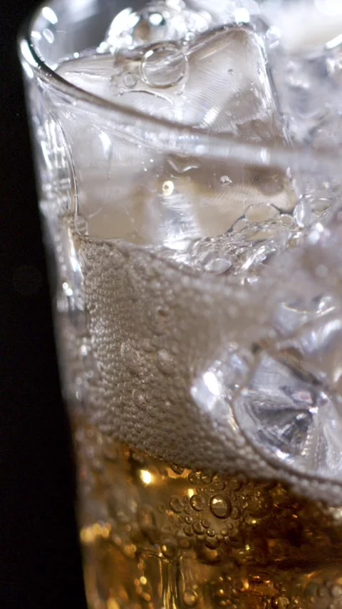 Sipping an Icy Drink in Mesmerizing Slow Motion Captures Every Drop and Bubble Stock Footage 336824423