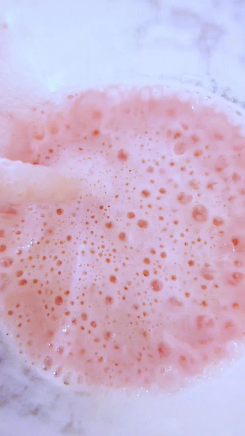 Sipping milkshake from straw in cafe close-up. Video stock 342778524