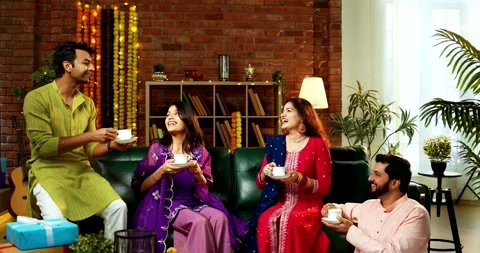 Sipping tea while celebrating Diwali with Indian family and friends in festival Stock Footage 342382364