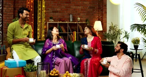 Sipping tea while celebrating Diwali with Indian family and friends in festival Stock Footage 342382419