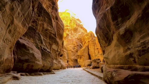 The Siq, a passageway between cliffs in the city of Petra. Stock Footage 144056369