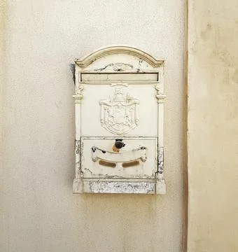 Siracusa, Sicily, Italy July 25, 2022: white old mailbox for letters hanging on Stock Photos