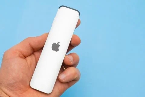 A Siri Remote controller for Apple TV 4K on the blue background with copy space Stock Photos