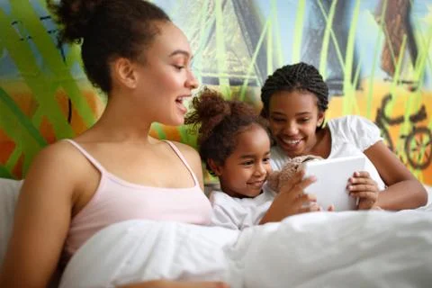 Sisters in bed Stock Photos