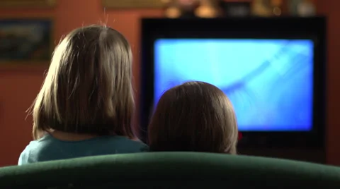 Sisters on the couch watching television Stock-Footage 27240396