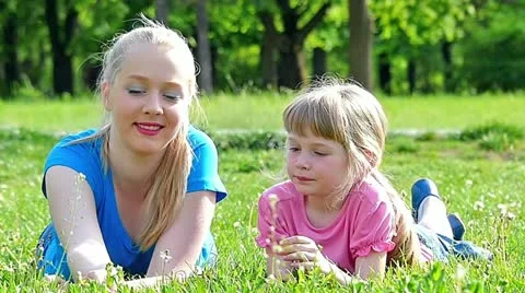 Sisters having fun in the park slow motion Stock Footage 24673475