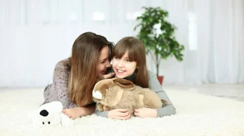 Sisters at home lying on the floor Stock Footage 10717253