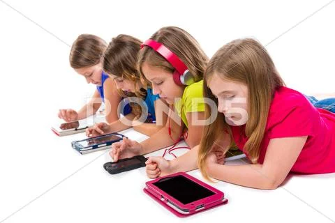 Sisters kid girls tech tablets and smatphones Stock Photos