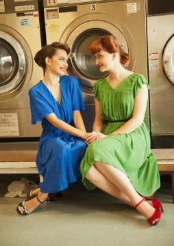 Sisters in laundry Stock Photos