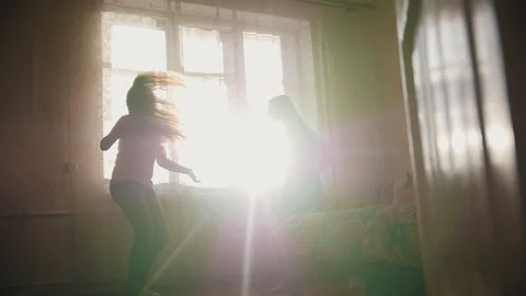 Sisters playing and smiling at home room - slow-motion Stock Footage 87111871