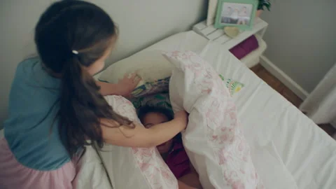 Sisters playing in the bed Stock Footage 279726521