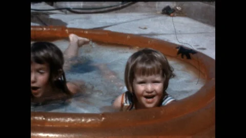 Sisters Pool Play 1963 Stock Footage 211900317