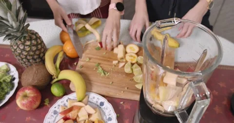 Sisters preparing healthy breakfast at kitchen Stock Footage 145825641