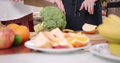 Sisters preparing healthy smoothie In kitchen Stock Footage 145825436