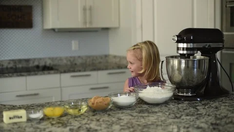 Sisters prepping to cook in a kitchen 스톡 동영상 95358213