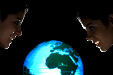 Sisters studying earth globe Foto stock