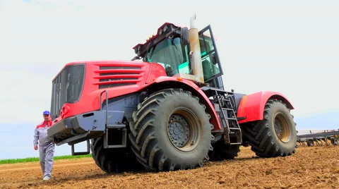 Sit in a tractor on the field Stock Footage 62784755