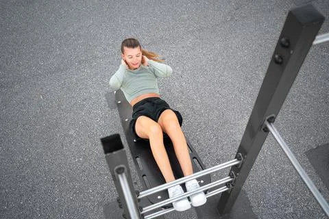 Sit-ups exercises. Active, fit sporty woman doing situps, exercising and trai Stock-Fotos
