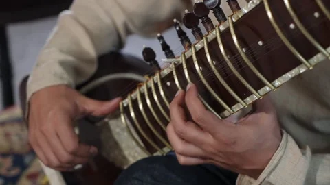 Sitar Hand Play, Focused Sitar Player Demonstrating Raga Techniques In Cozy Stock Footage 323772097