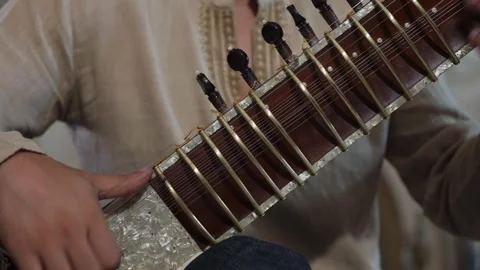 Sitar Hand Play, Focused Sitar Player Demonstrating Raga Techniques In Cozy Stock Footage 323772658