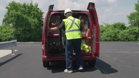 On site Construction contractor Opens Door to Van as He arrives at USA jobsite Stock Footage 161800939