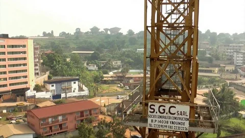 Site crane overlooking Yaoundé Stock Footage 80847284