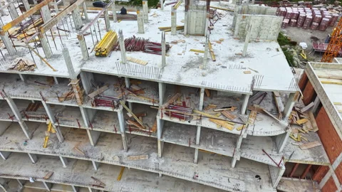 Site features current construction with workers and equipment present. Aerial Stock Footage 340148249