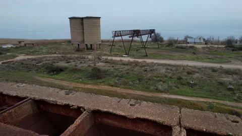 Site of the loading of ore by crane into the wagons of the freight train Stock Footage 229682036