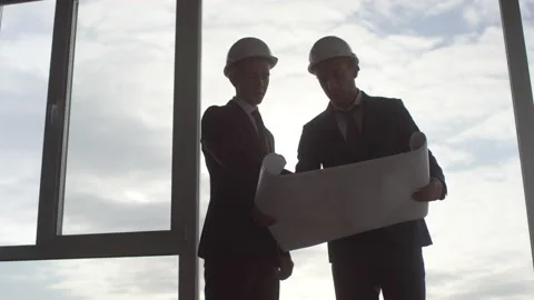 Site Managers Studying Blueprint before Panoramic Window Stock-Footage 131291879