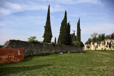 Site next to a boundary wall in a park by the hillside Stock Photos