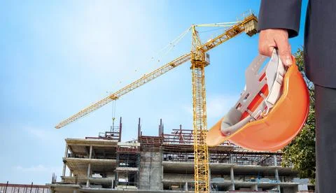 The site is under construction, a large building with a yellow crane. Stock Photos