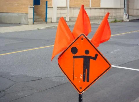 Site under construction, orange panel sign Foto stock