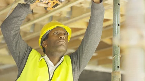 Site worker working with electric drill at construction site Stock Footage 108198802