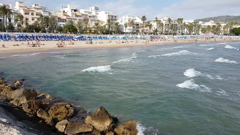 Sitges beach sea ocean waves lapping on shore Stock Footage 102903249
