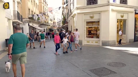 SITGES, SPAIN - SEPTEMBER 28, 2024: People walk on one street in old town Stock Footage 327636076