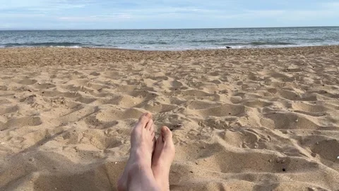 Sitting alone on the beach Stock Footage 313368561