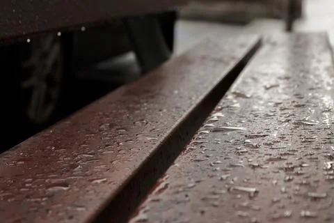 Sitting alone on a bench in the rain Stock Photos