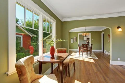 Sitting area by the window with table and chairs Stock Photos