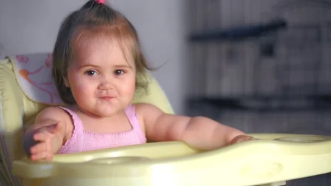 Sitting baby eats Stock Footage 98699818