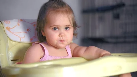 Sitting baby eats Stock Footage 98699860