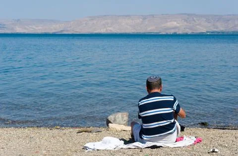 Sitting on the beach Foto stock