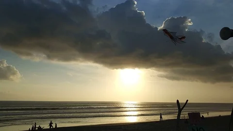 Sitting on beach side on Bali beach sunset Stock Footage 91573169