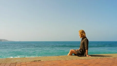 Sitting beside the beach Video stock 107682081