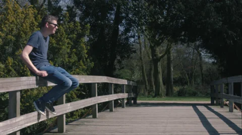 Sitting on a bridge Stock Footage 49167937