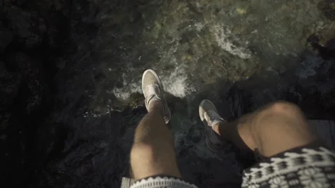 Sitting on a bridge over a river Video stock 139204694