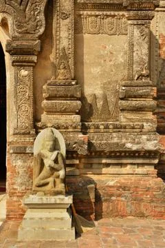 Sitting Buddha statue in front of one of hundred old temples in Bagan, Myanma Stock Photos