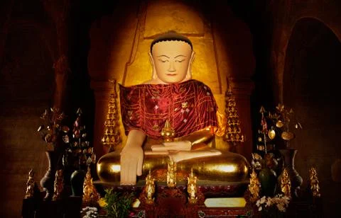 Sitting Buddha statue inside one of hundred old temples in Bagan, Myanmar Stock Photos