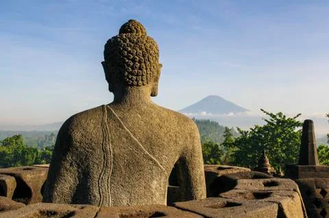Sitting buddha in the temple complex of borobodur, unesco world heritage site Stock Photos