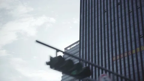 Sitting in a car low-angle shot buildings in the city. Stock Footage 172053178