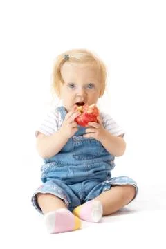 Sitting child with the apple Foto stock